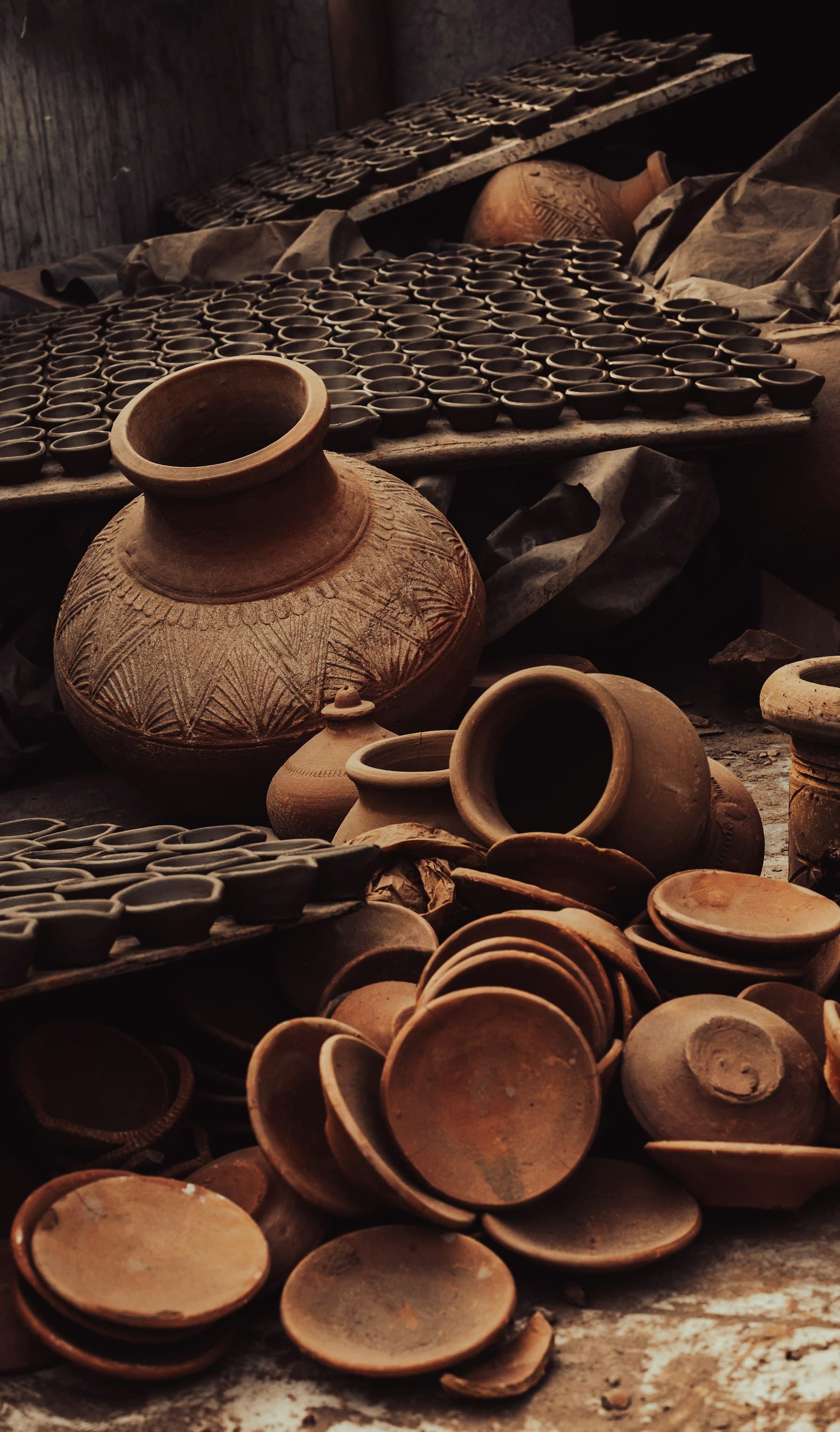 Carved terracotta pots and diyas