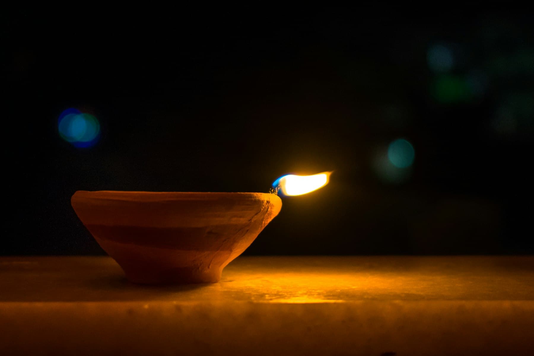 A lit clay diya