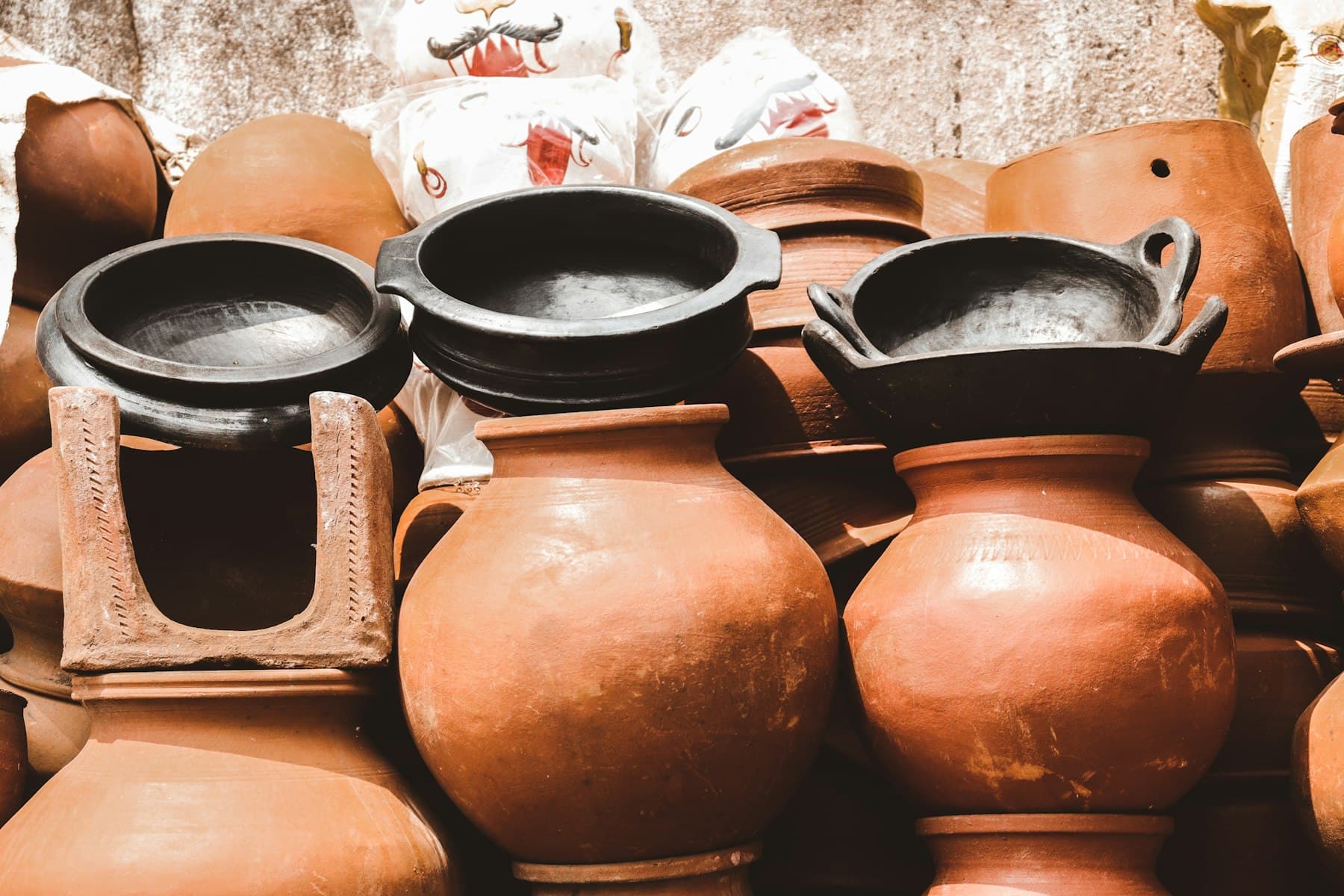 Stacked terracotta and blackened clay pots